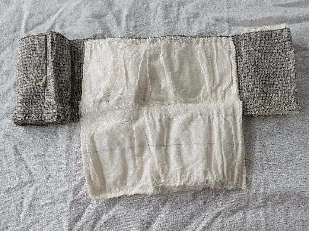 Fold out dressing pad